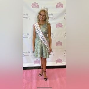 Fit and Flare with embellished neckline and bow accent on the back